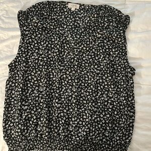 Floral print blouse with banded bottom and shoulder ruching.